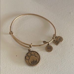 Gold Alex and Ani bracelet with pawprint charm